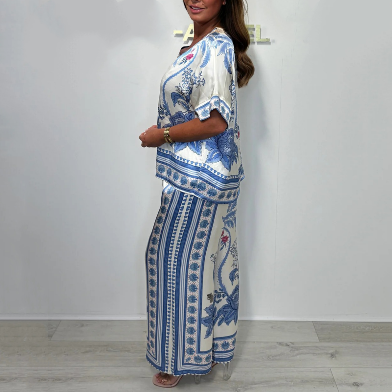Elegante completo stampato da donna composto da due pezzi: top con scollo a V e pantaloni